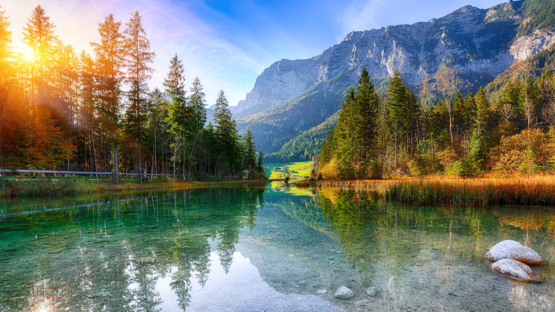 Fantastic autumn sunset of Hintersee lake. Beautiful scene of trees near turquoise water of Hintersee lake. Location: resort Ramsau, National park Berchtesgadener Land, Upper Bavaria, Germany Alps, Europe